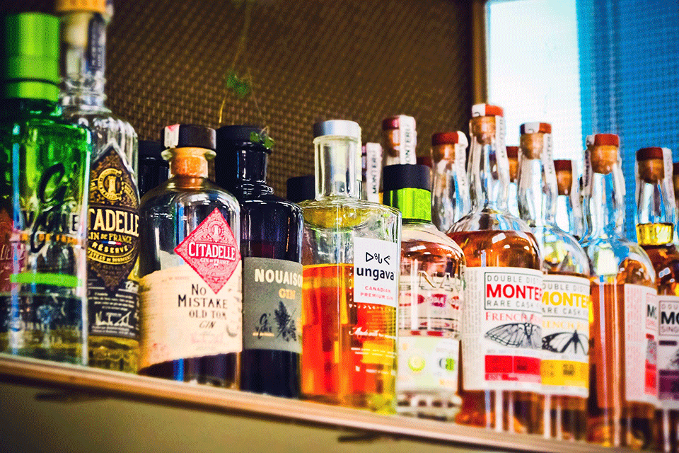 Image: Bottles of alcohol on a bar shelf