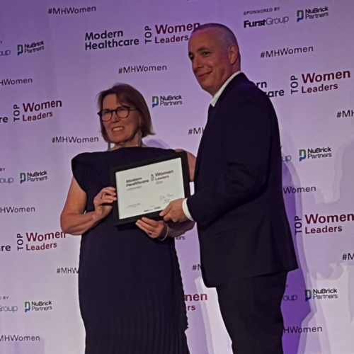 Mary A Pittman receiving Top Women Luminary 2023 award