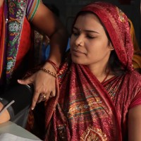 woman getting her blood pressure measured