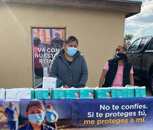 community worker distributing masks