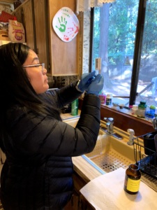 a woman taking a tap water sample