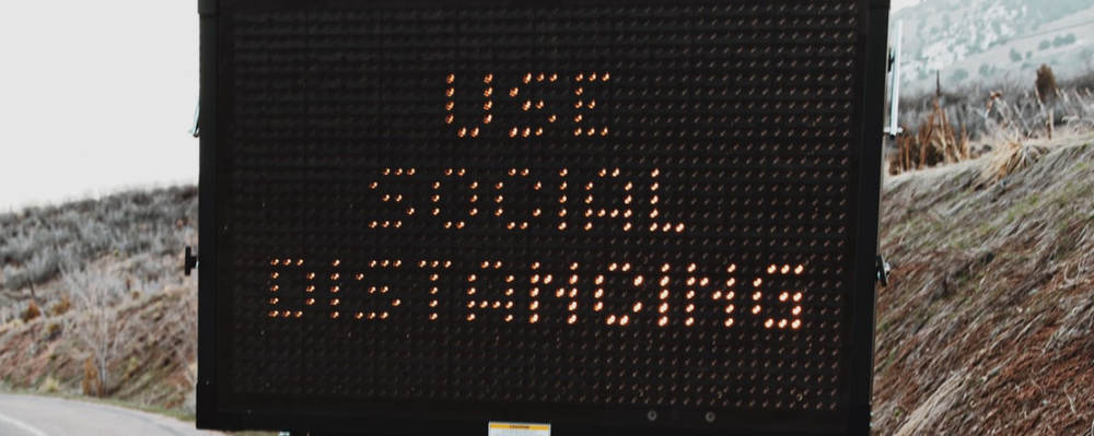 light up, roadside sign "Use Social Distancing"