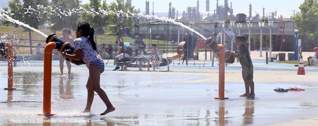 Children play at a waterfront park near the industrial Port of Los Angeles, between the Valero and Phillips 66 refineries right beside the Los Angeles
