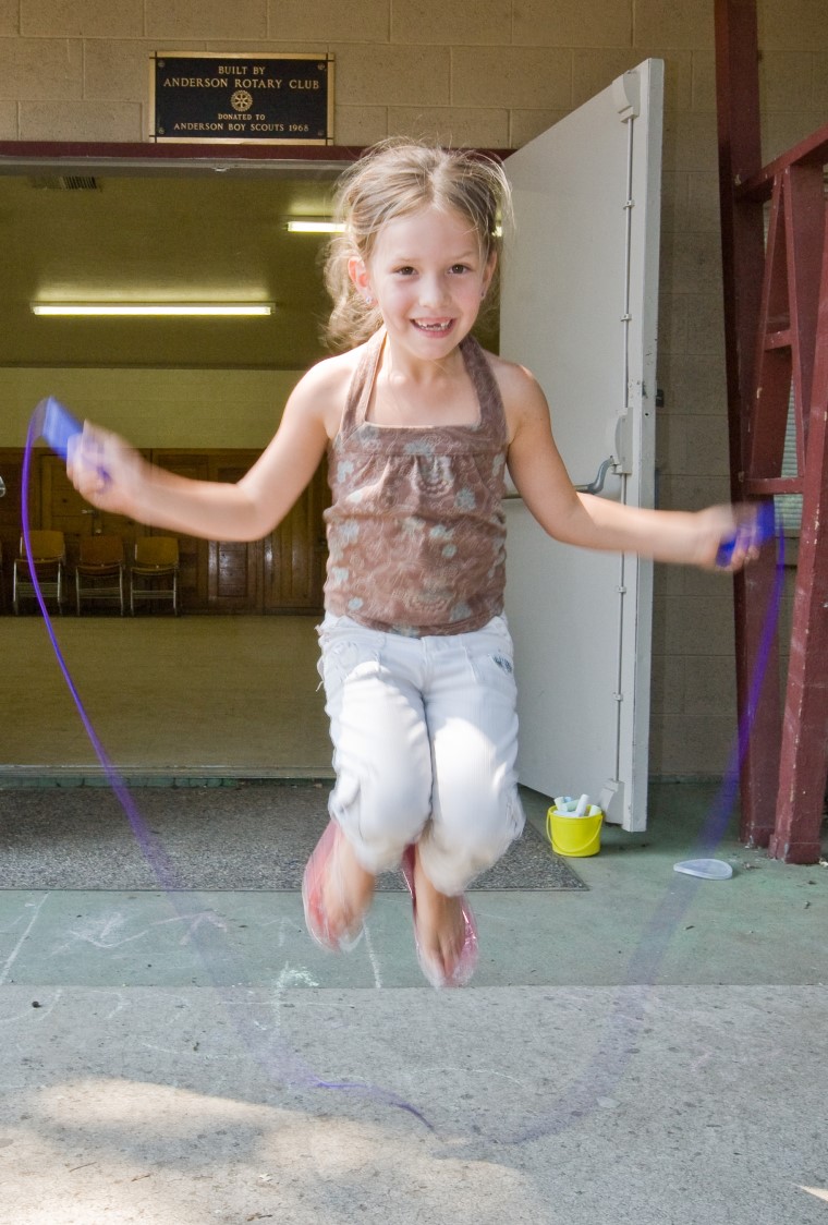 young girl jumping rope
