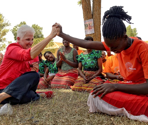 Two women holding hands, raised over their heads