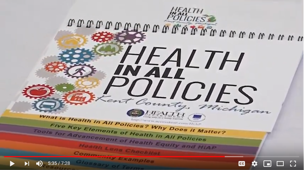 Screenshot from a video, showing the "Health in All Policies" guide for Kent County, MI