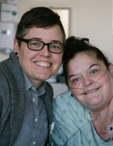 A patient and a Substance Abuse Navigator, smiling and looking at camera