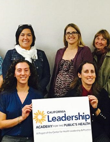 CaLAPH Oakland Group photo, holding a sign