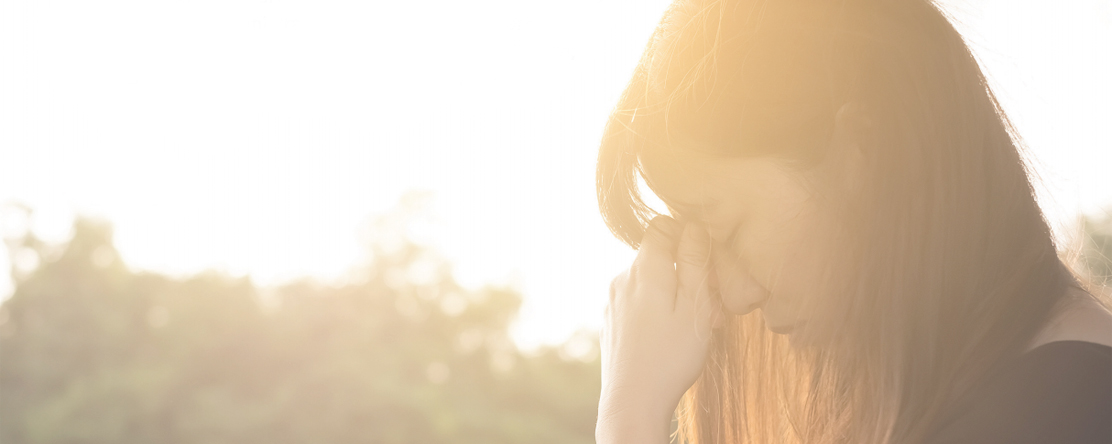 image: woman with hand on her head