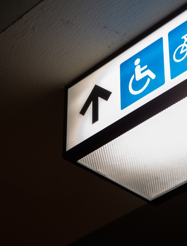 Picture of disability signage in a hospital. Photo by Charles Deluvio on Unsplash