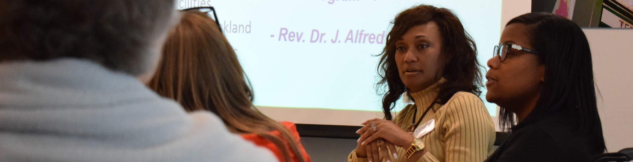 woman listening intently to someone speaking to her