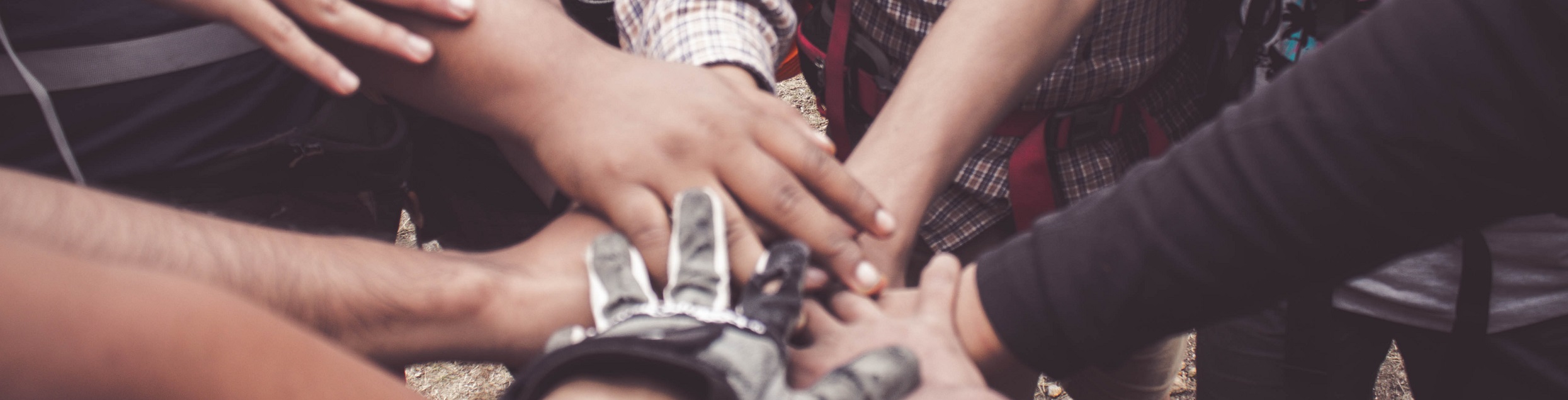 Close shot of many hands