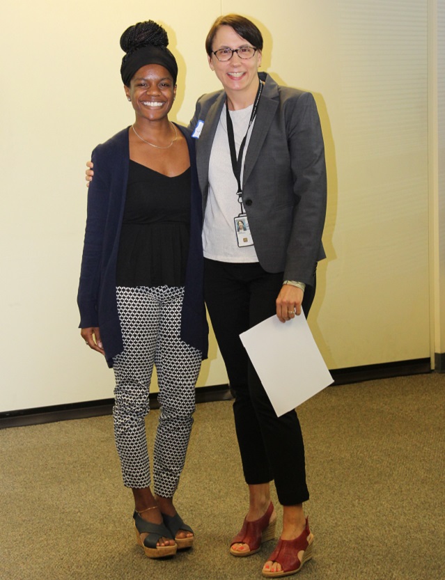 A PHI/CDC Fellow and Mentor, smiling at camera