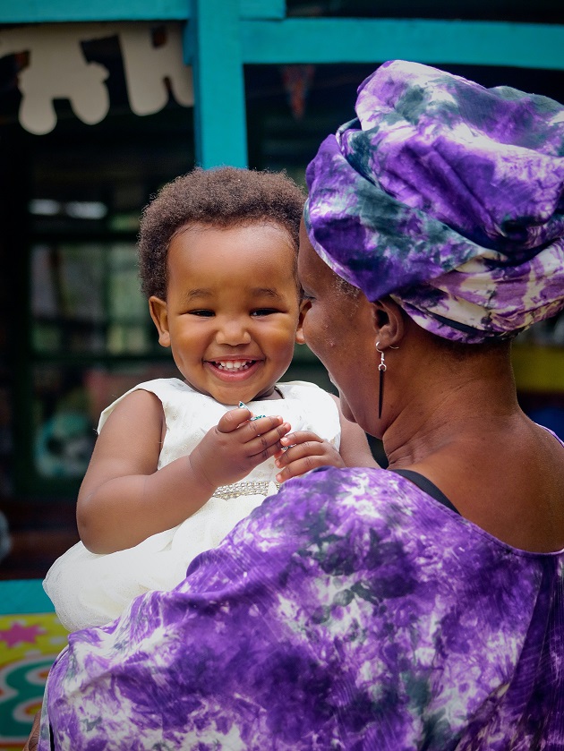 Grandmother and grandaughter, smiling