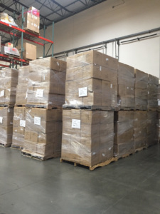 boxes of ppe arriving in a warehouse