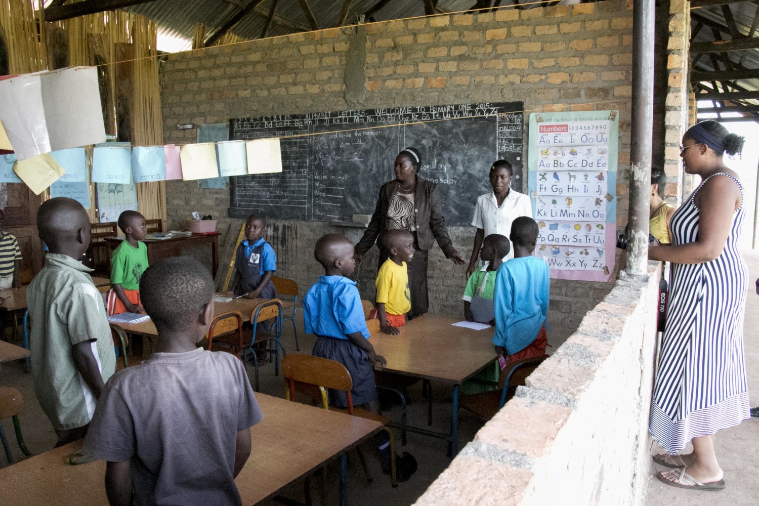 image: global health fellow in classroom with children