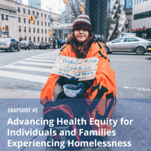 image: homeless woman holding sign