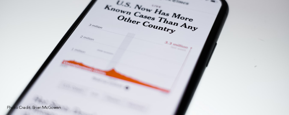 image: article "US Now Has More Known Cases Than Any Other Country" on smartphone