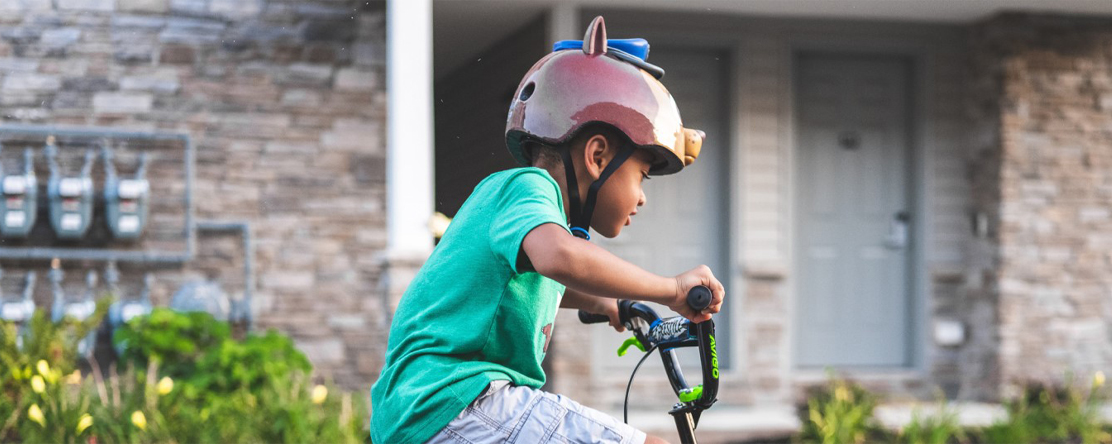 image: child riding bike
