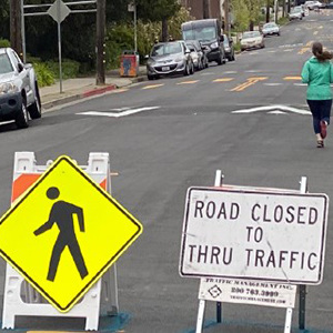 image: woman running on closed road