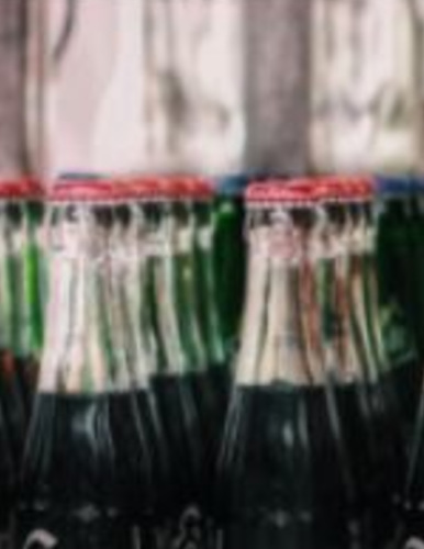 the tops of several bottles of cola