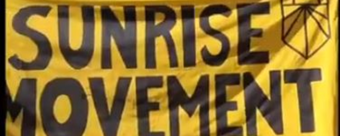 a bright yellow banner reading "Sunrise Movement"