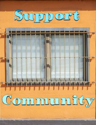 a yellow door with the words "support community"