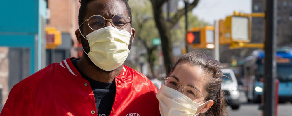 man and woman wearing face mask