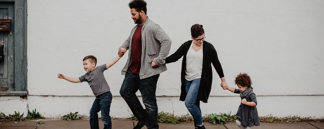 Family walking together down the street