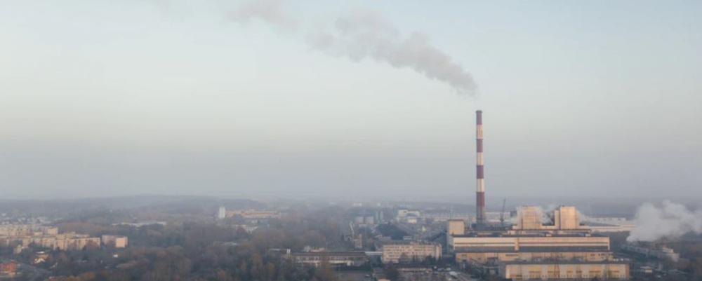 a smokestack in the distance