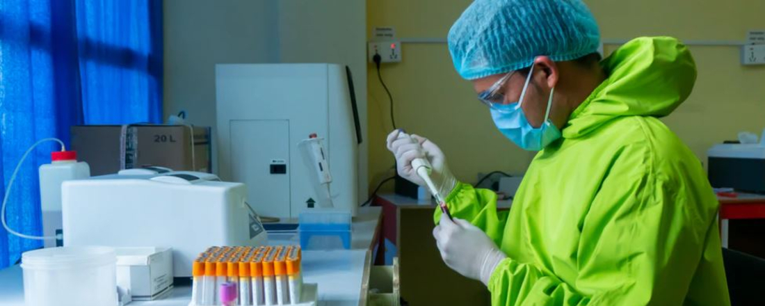 a lab worker in protective gear