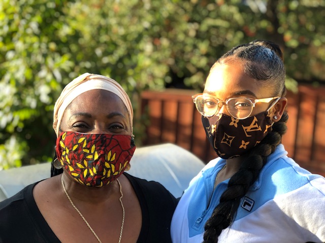 Valerie and daughter wearing a face mask