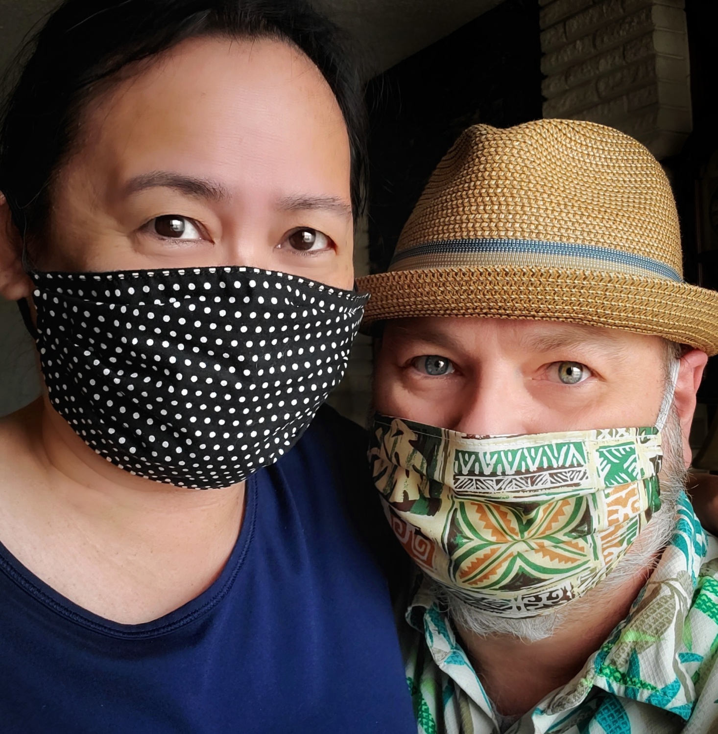 Baine and wife wearing face masks