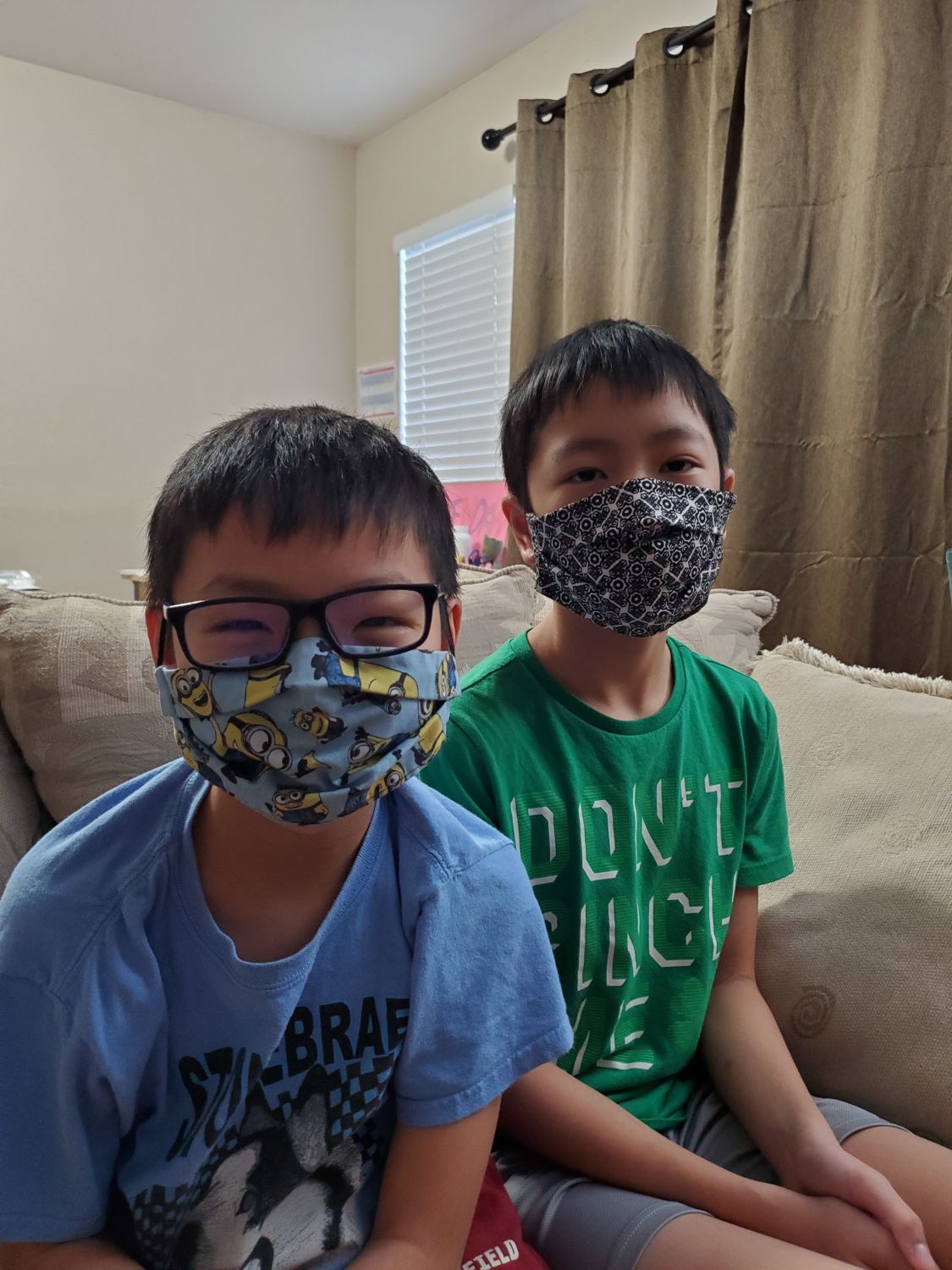 Emily's sons wearing face masks