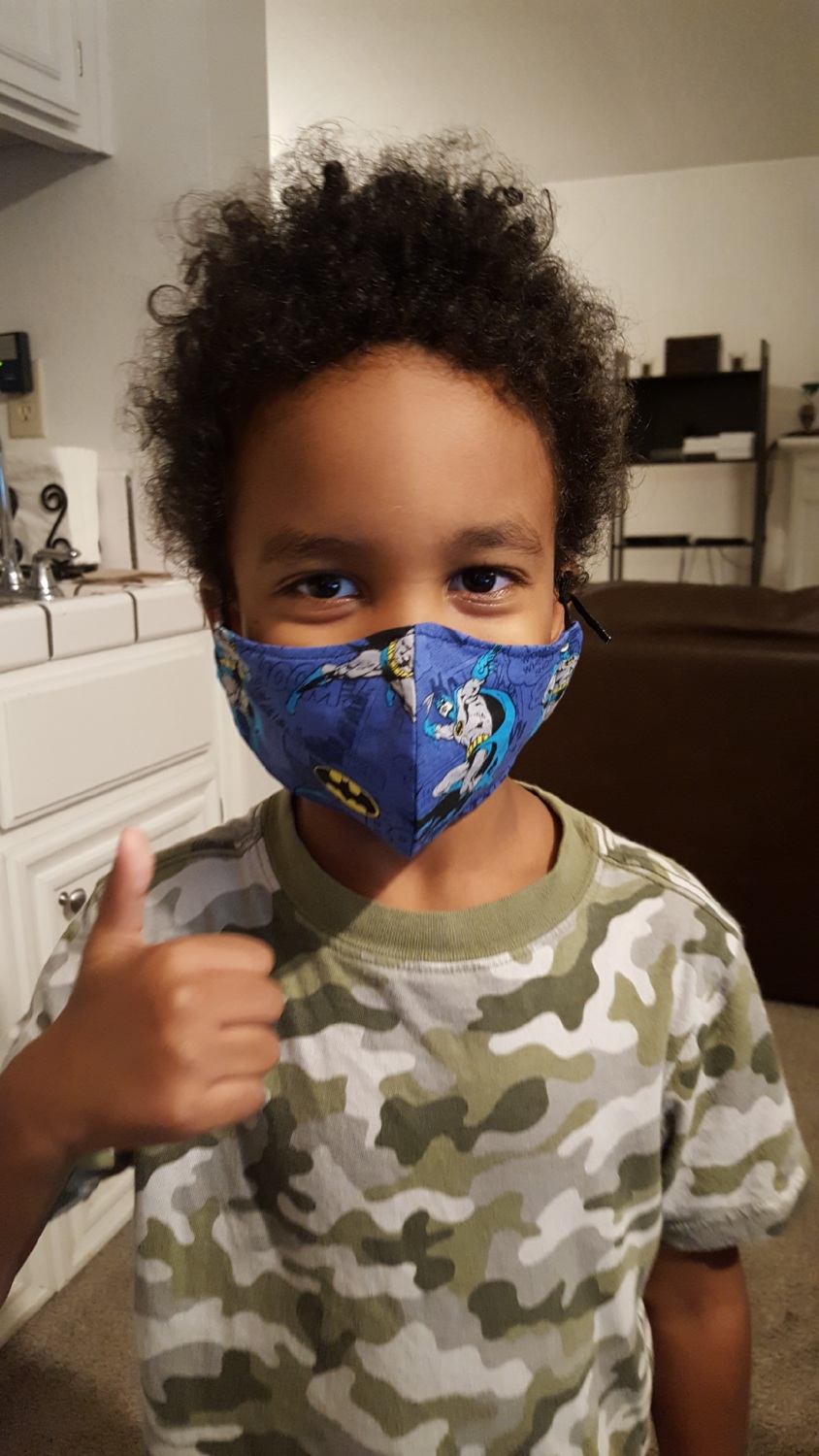 PHI's Stephanie's youngest son wearing a face mask