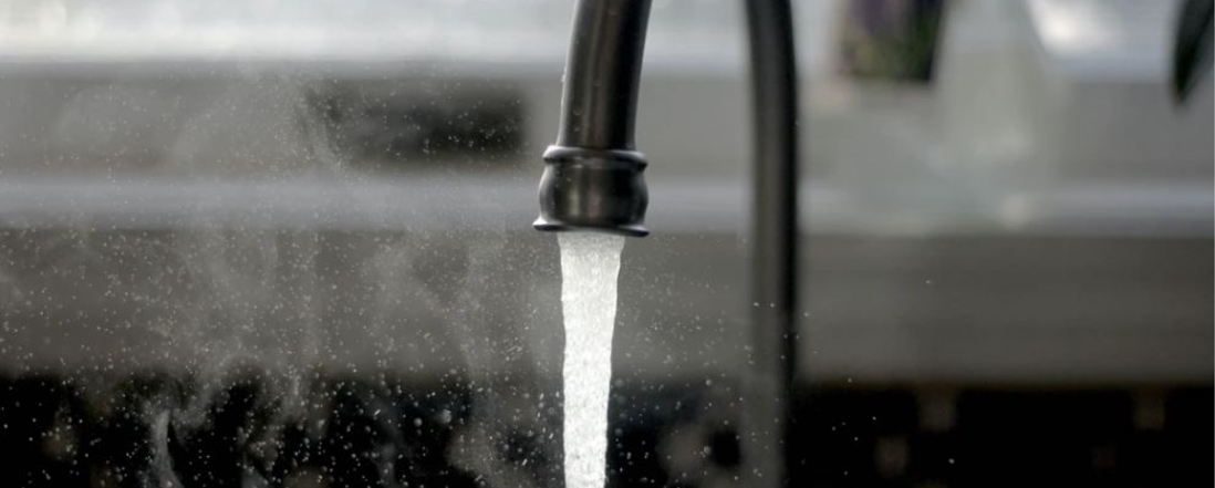 water flowing out of a kitchen sink