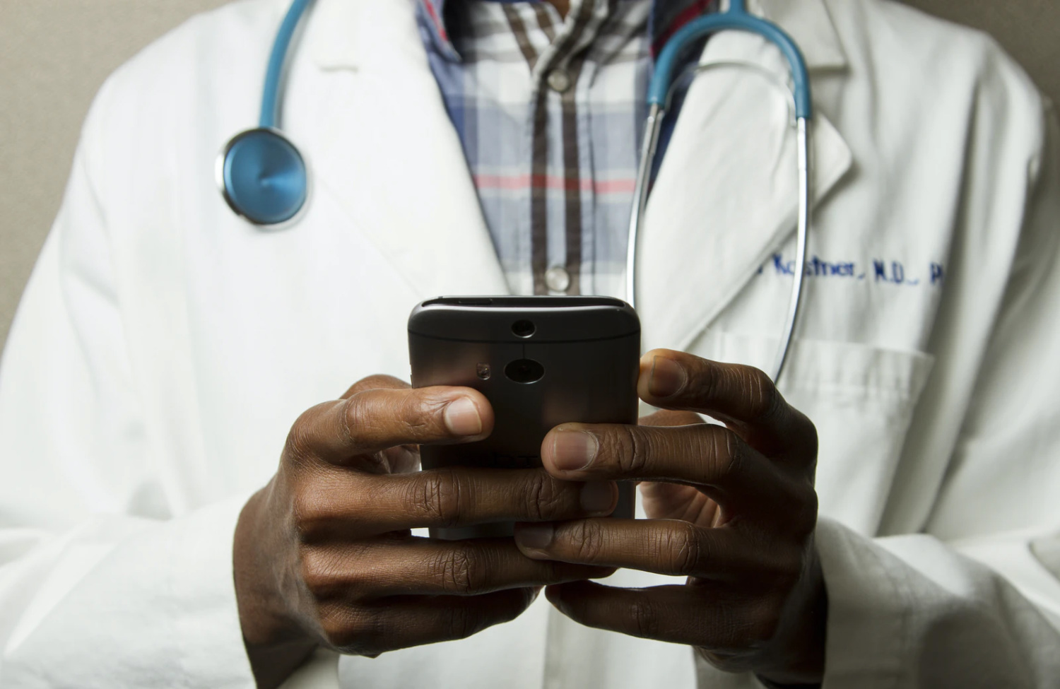 doctor holding smartphone