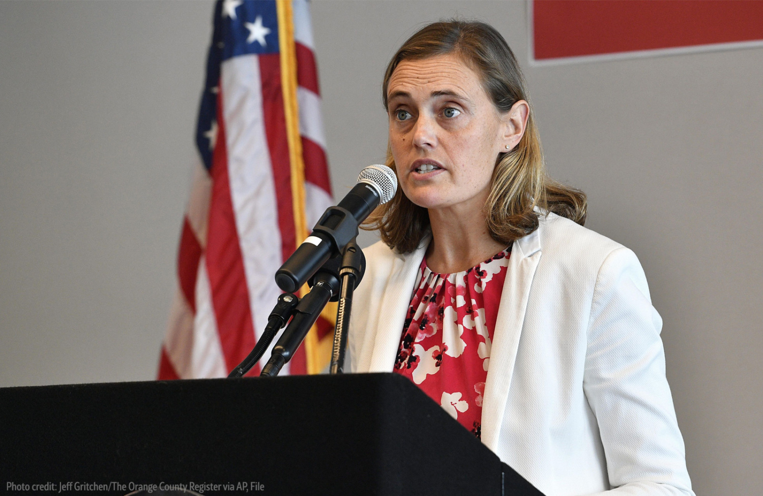 Dr. Nichole Quick behind podium