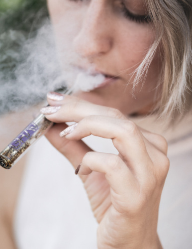 a young woman vaping