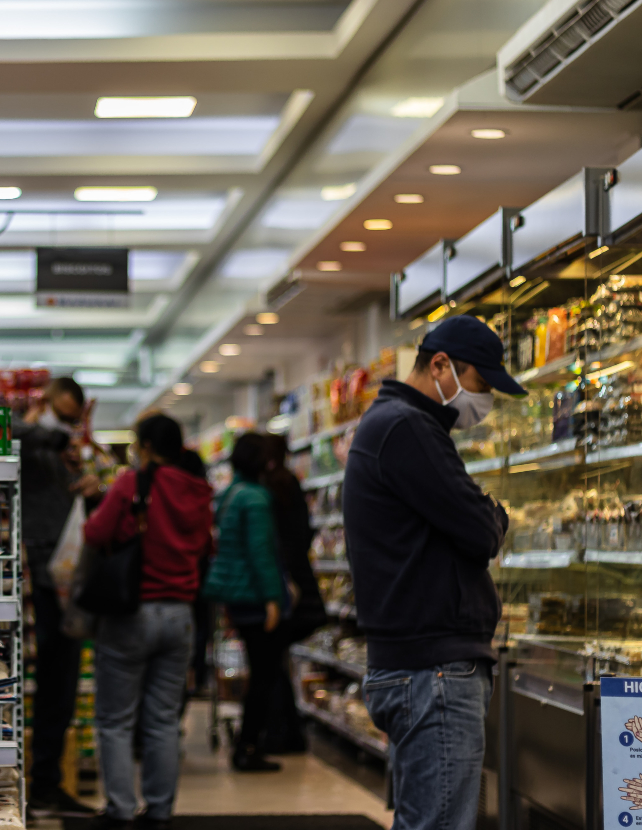 shoppers in masks at the market