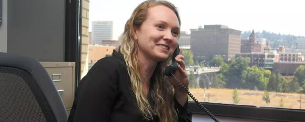 a woman in an office on the phone