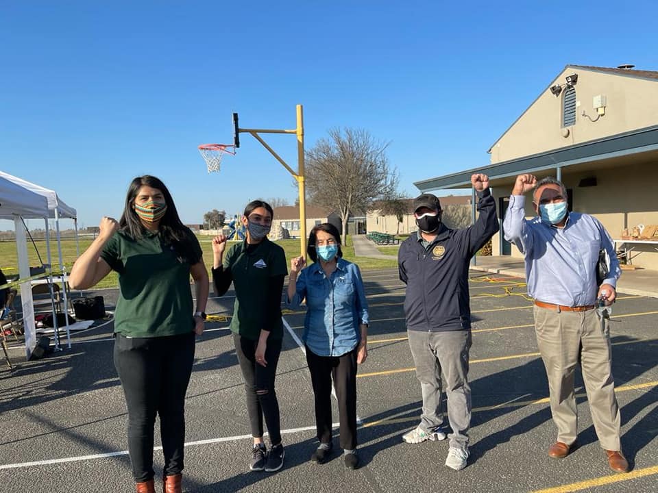 group of people wearing masks