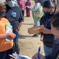 Volunteers helping people get vaccinated