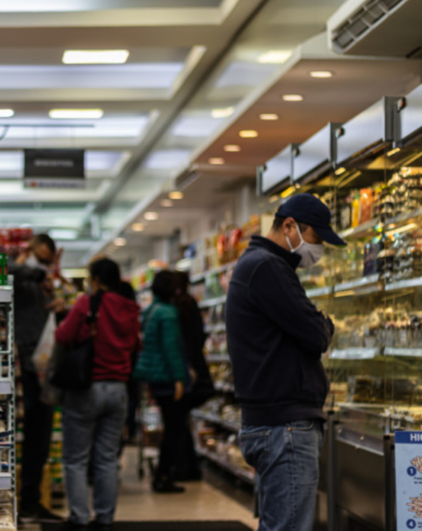 shoppers in masks at the market