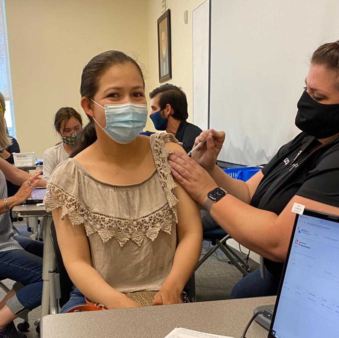 Woman getting COVID-19 Vaccine