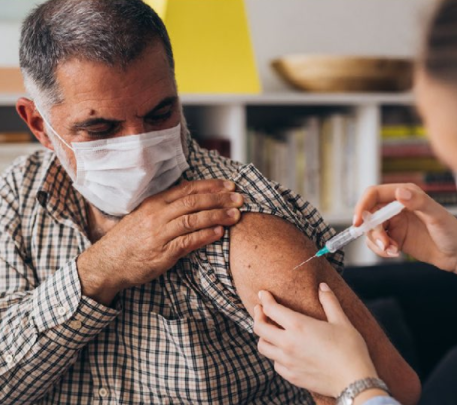 Man receiving COVID vaccine