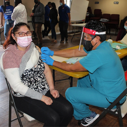 Woman getting COVID-19 vaccine