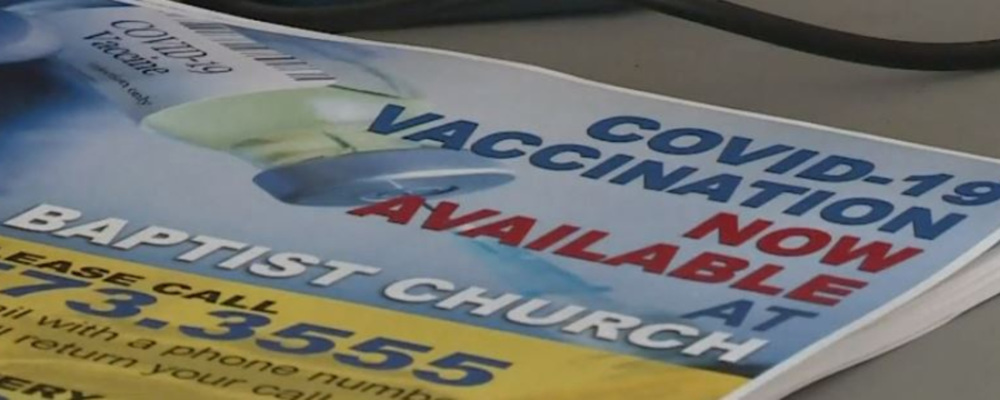 a flyer offering COVID vaccinations at a Baptist church