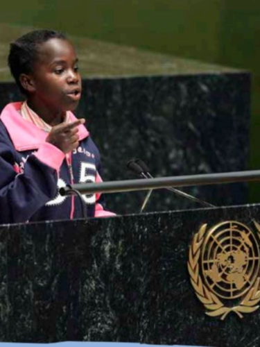 a young woman giving a speech at the UN