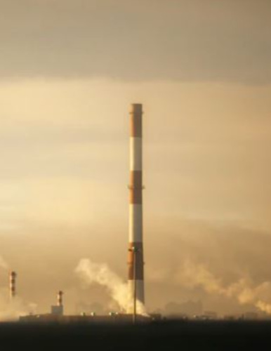 a smokestack in a hazy background